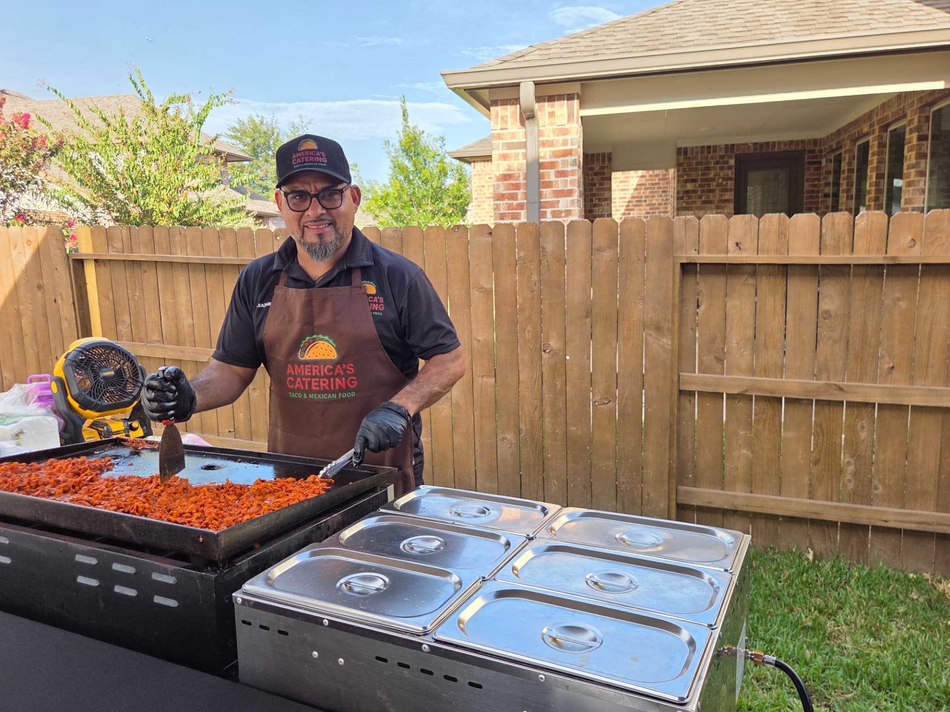 America's Catering chef grilling al pastor on the live griddle